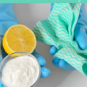 baking soda and lemon with gloves on white background