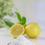 lemon and baking soda on white background