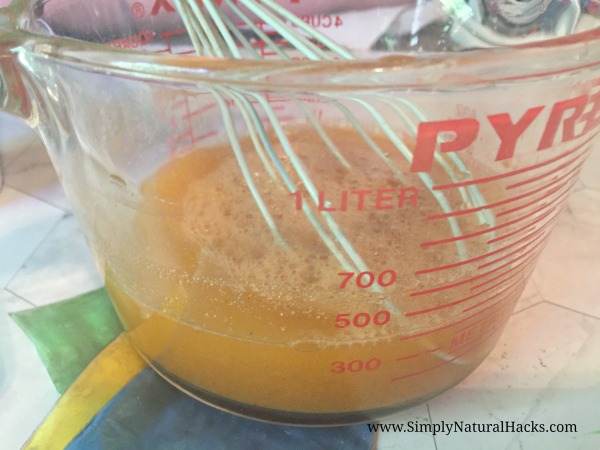 orange liquid in measuring glass